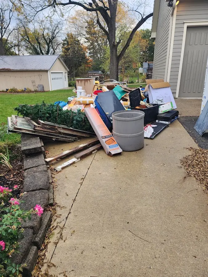 Dumpster being loaded with debris for 3 Yard Dumpster Rental in Ashland City